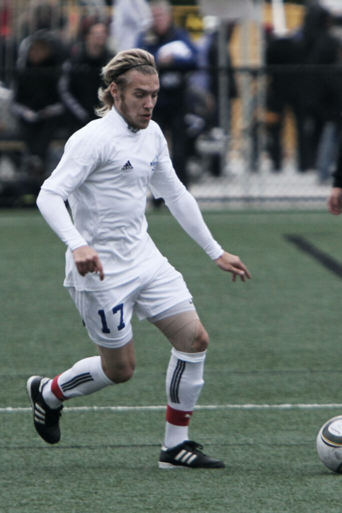photo of soccer player Stephen Ewashko with a soccer ball
