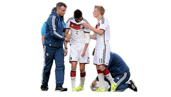 Photo of Johannes Buehler injured during a game for Germany vs. England, being consoled by a trainer and teammate.