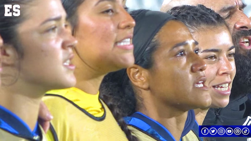 Photo of El Salvador substitutes singing the El Salvadorian National Team.